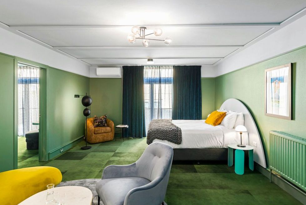 Elegant hotel interior at Happymotion with warm lighting and timber finishes